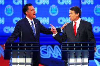 Mitt Romney and Rick Perry take part in the GOP presidential debate sponsored by CNN on Tuesday, Oct. 18, 2011, at the Venetian.