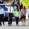 President Barack Obama walks with, from left, Jose Bonilla, Lissette Bonilla and their children Margarita Bonilla, Franco Bonilla and Mario Bonilla before Obama spoke about the American Jobs Act on Oct. 24, 2011, in Las Vegas. Obama also announced a housing initiative to help homeowners with federally guaranteed mortgages refinance their homes.