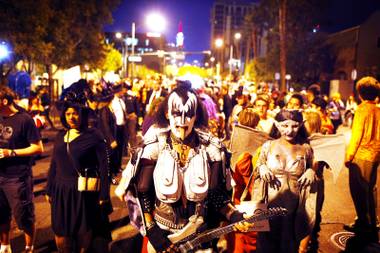 Gary Downe of Las Vegas, dressed in a homemade costume as Gene Simmons of KISS, walks in the Las Vegas Halloween Parade in downtown Las Vegas on Monday, Oct. 31, 2011.