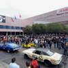 Customized vehicles parade through the streets Friday, Nov. 4, 2011, as exhibitors left the 2011 SEMA Show at the Las Vegas Convention Center. 