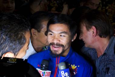 Filipino boxer Manny Pacquiao is interviewed after arriving at the MGM Grand on Tuesday, Nov. 8, 2011. Pacquiao will face Mexican boxer Juan Manuel Marquez for the third time when they fight at the MGM Grand Garden Arena on Saturday.