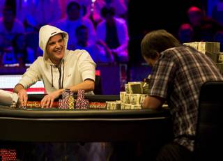 Pius Heinz, left, of Germany smiles as he competes heads up against Martin Staszko of the Czech Republic during the World Series of Poker Main Event at the Rio on Tuesday, Nov. 8, 2011.