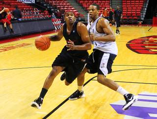 UNLV guard Oscar Bellfield, left, plays one-on-one with Bryce Jones at practice Tuesday, Nov. 8, 2011.