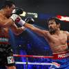 Manny Pacquiao, right, of the Philippines punches at Juan Manuel Marquez of Mexico during their WBO welterweight fight at the MGM Grand Garden Arena Saturday, Nov. 12, 2011. Pacquiao won the 12-round fight by majority decision.