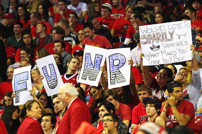 UNLV fans hold up signs during their game against Nevada-Reno Monday, Nov. 14, 2011 at the Thomas & Mack Center. UNLV won the game 71-67.