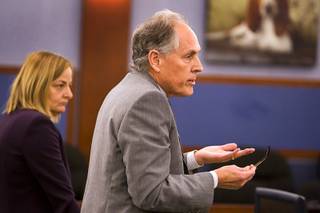 Richard Wright, attorney for Dr. Dipak Desai, speaks to District Court Judge Kathleen Delaney at the Regional Justice Center Tuesday, November 15, 2011. At left is attorney Margaret Stanish. Judge Delaney set a Jan. 27 hearing date for the defense to challenge a competency finding.