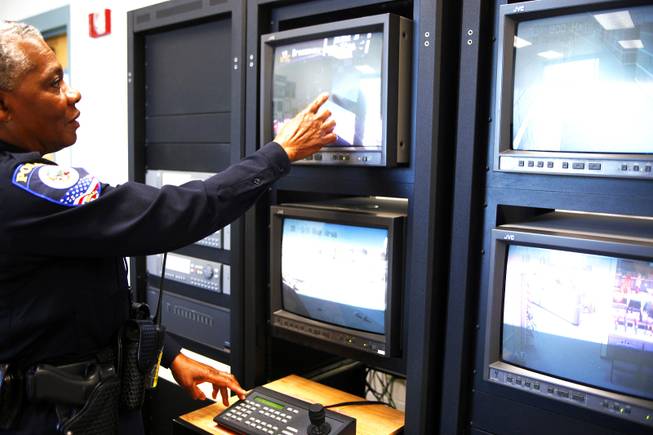 Clark County School District Police officer Ruby Riley looks at surveillance camera footage inside the security office at Mojave High School in North Las Vegas Thursday, Nov. 17, 2011.