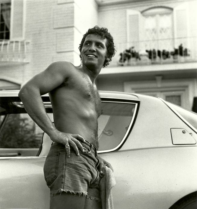 In this undated photo, a shirtless Bob Anderson is seen next to a car.