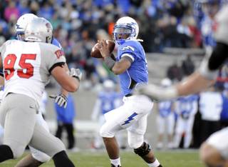 Air Force quarterback Tim Jefferson Jr. (7) controls the ball against UNLV in the first half of an NCAA college football game at Falcon Stadium in Air Force Academy, Colo., Saturday, Nov. 19, 2011. 