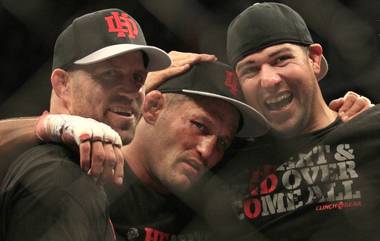 Dan Henderson, center, celebrates with teammates after beating Mauricio Rua during a UFC 139 Mixed Martial Arts light heavyweight bout in San Jose, Calif., Saturday, Nov. 19, 2011. Henderson won by unanimous decision.