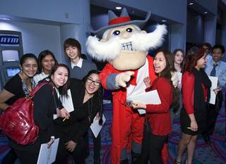 UNLV mascot Hey Reb poses with Chesley Estrada of East Career and Technical Academy and other students before the 2011 Las Vegas Sun Youth Forum at the Las Vegas Convention Center on Tuesday, Nov. 22, 2011. Nearly 1,000 students from 52 schools participated in the annual event.