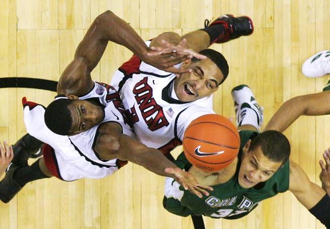 UNLV's Mike Moser, left, and Anthony Marshall grab a rebound from Cal Poly forward David Hanson during their game Tuesday, Nov. 22, 2011 at the Thomas & Mack Center. UNLV won the game 75-52.