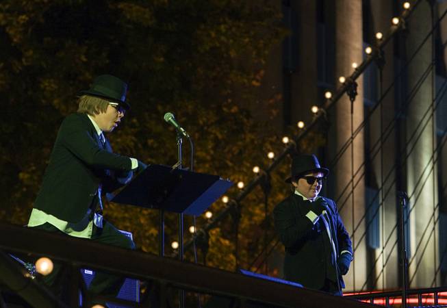 A Blues Brothers tribute band performs for runners during the ...