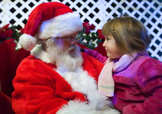 Santa talks with Lauren Nowak, 4, during the Holiday Spectacular at the Springs Preserve, Sunday, December 11, 2011. The Holiday Spectacular will continue on Saturday, Dec. 17 and run through Friday, Dec. 23.  .