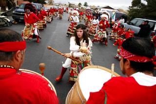 Members of the Matachines de Ciudad Juarez perform the Dance of the Matachines in honor of the festival of the Virgin of Guadalupe outside a home in North Las Vegas Monday, December 12, 2011.