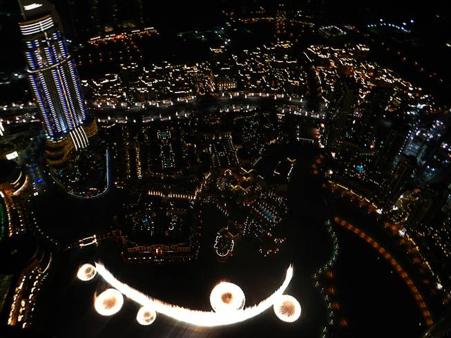 in Dubai, United Arab Emirates, a view of the city and Dubai fountain from the Burj Khalifa observation tower.  December  2011.