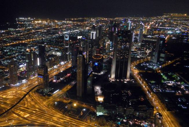A view of Dubai's city center is shown from the Burj Khalifa's observation tower.