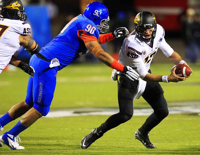 Boise State tackle Billy Winn chases down Arizona State quarterback Brock Osweiler during the Maaco Bowl Las Vegas Thursday, Dec. 22, 2011 at Sam Boyd Stadium. Boise State won the game 56-24.