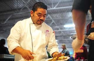 Executive Chef Juan Carlos Penate garnishes a dish at the Catholic Charities of Southern Nevada on Dec. 25, 2011. The nonprofit served more than 1,500 people at its annual Christmas dinner.