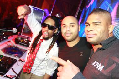 Alistair Overeem, with Lil Jon and Sidney Samson, celebrates his UFC 141 victory at Surrender on Dec. 30, 2011.