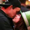 Shane Williams and Judith Lanuza, both of Las Vegas, share a kiss during TributePalooza at the Fremont Street Experience in downtown Las Vegas on New Year's Eve Saturday, Dec. 31, 2011.