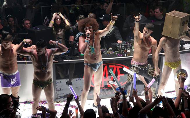 Redfoo, center, of LMFAO at Haze in Aria on Dec. ...