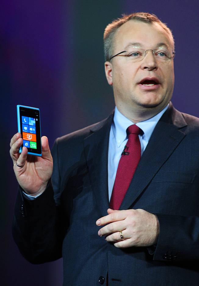 Stephen Elop, CEO of Nokia, holds a Lumina 900 Windows smartphone during a Qualcomm keynote address at the 2012 International Consumer Electronics Show (CES) in Las Vegas, Nevada, January 10, 2012.  The phone uses a Qualcomm Snapdragon processor.