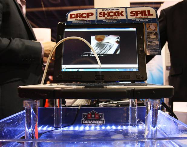 Water drips on the keyboard of an Ace Durabook during the 2012 International Consumer Electronics Show (CES) in Las Vegas, Nevada, Jan. 11, 2012. The semi-rugged laptop has a waterproof keyboard and a drain so the keyboard area can be flushed out if you spill a drink on it. CES, the world's largest consumer technology tradeshow, runs through Friday.