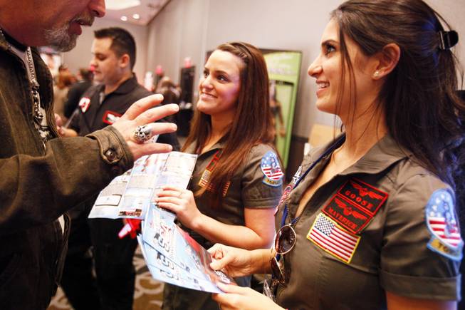 Bailey Stewart and Anjali Patel promote Sky Combat Ace, a Henderson flight company, at the AVN Adult Entertainment Expo 2012 inside the Hard Rock Hotel on Wednesday, Jan. 18, 2012.