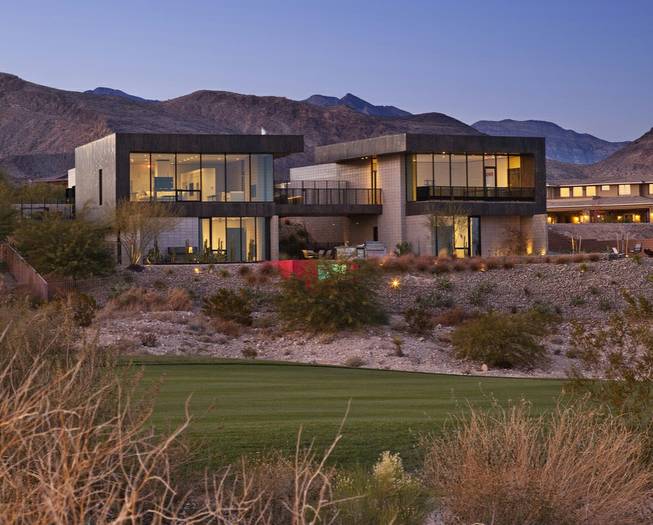 Architect Eric Strain designed this award-winning house on a hillside in Summerlin to be adaptable to the desert. There are no windows at the rear because they would face west -- and the punishing afternoon heat. Instead, the back of the home is garage, which acts a buffer between the living space and the sun.