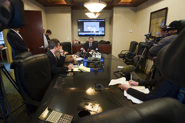 Robert Martin, center, attorney for former Henderson City Councilwoman Kathleen Vermillion, speaks during a news conference at the Martin & Allison law offices Monday, Jan. 23, 2012. Martin disputed allegations by Clark County Commissioner Steve Sisolak that Vermillion, Sisolak's former girlfriend, Mark Fierro, a public relations expert, and Martin were involved in an an extortion attempt.