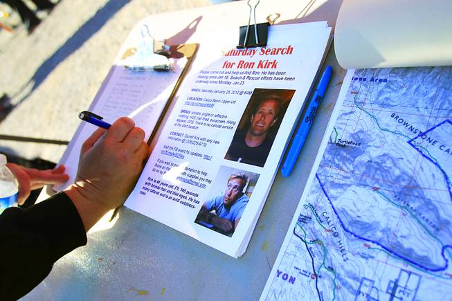 A volunteer signs in to help search for missing outdoorsman ...