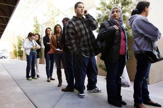 People line up outside of the Community Multicultural Center to sign up for ESL classes near Tropicana and Eastern in Las Vegas Wednesday, Feb. 1, 2012.