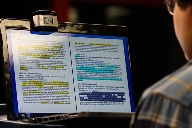 A monitor is used to highlight argumentative points in a speech read at 300-400 words per minute by freshman Will Pregman while practicing in a mock debate with the UNLV Debate team Monday, Feb. 1, 2012, in Las Vegas.