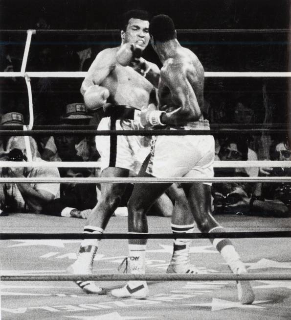 Larry Holmes rocks Muhammad Ali with a hard right en ...