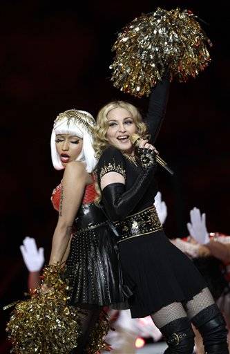Madonna, right, performs with Nicki Minaj during halftime of the NFL Super Bowl XLVI football game between the New England Patriots and the New York Giants Sunday, Feb. 5, 2012, in Indianapolis. (AP Photo/David J. Phillip)