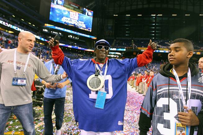 Henderson resident Flavor Flav celebrates the New York Giants victory against the New England Patriots at Super Bowl XLVI at Lucas Oil Stadium in Indianapolis on Tuesday, Feb 5, 2012.