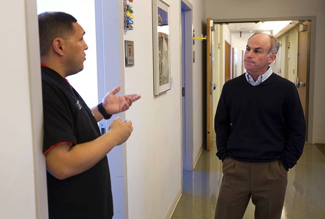 Research Coordinator Triny Cooper, left, talks with neurologist Charles Bernick, principal investigator of the Professional Fighters Clinical Research Study, at the Cleveland Clinic Lou Ruvo Center for Brain Health Friday, February 10, 2012.