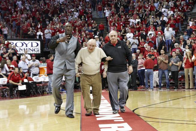 Former UNLV head coach Jerry Tarkanian and other members of the 1986-1987 Final Four Rebels team are honored at halftime of the UNLV game against San Diego State Saturday, Feb. 11, 2012. At left is Eldridge Hudson, a power forward on the legendary team.