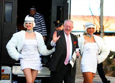 Former Las Vegas Mayor Oscar Goodman, center, arrives for the grand opening of the Mob Museum in Las Vegas on Tuesday, Feb. 14, 2012. Goodman also is known as a former mob attorney for representing alleged mobsters such as Meyer Lansky, Frank Rosenthal and Anthony Spilotro.