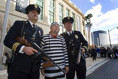 Members of the San Diego Police Museum Association, left to right, Ed LaValle, Scott Murray, and Jeff Gaskin, pose during the grand opening of The Mob Museum in Las Vegas, Tuesday February 14, 2012. The museum, in a former federal courthouse and post office, is one of 14 sites in the nation that hosted the 1950-51 U.S. Senate Special Committees to investigate Crime in Interstate Commerce, also known as the Kefauver hearings.