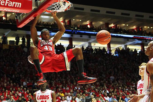 UNLV forward Mike Moser dunks on New Mexico during the first half of their game Saturday, Feb. 18, 2012 at The Pit in Albuquerque, N.M.