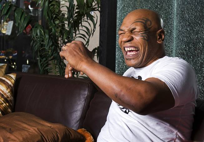 Boxer Mike Tyson, former undisputed heavyweight champion, responds to a ...
