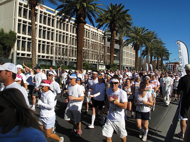 Runners head out on the first Color Run in downtown Las Vegas, Saturday, Feb. 25, 2012. About 5,000 participants ran a 5K event which benefits the Three Square charity.