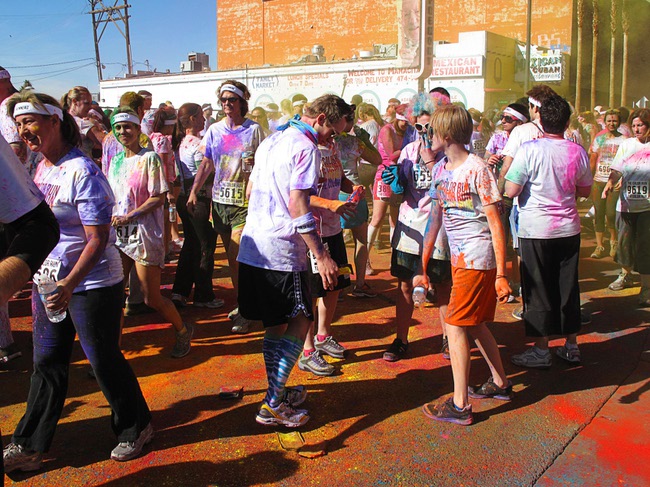 Runners are shown at a dust party after the first Color Run in downtown Las Vegas, Saturday, Feb. 25, 2012. About 5,000 participants ran a 5K event which benefits the Three Square charity.