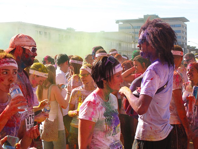 Runners are shown at a dust party after the Color Run in downtown Las Vegas, Saturday, Feb. 25, 2012. About 5,000 participants ran a 5K event which benefits the Three Square charity.