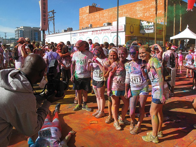 Runners pose for a photo during first Color Run in downtown Las Vegas, Saturday, Feb. 25, 2012. About 5,000 participants ran a 5K event which benefits the Three Square charity.