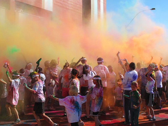 Runners are shown at a dust party after the first Color Run in downtown Las Vegas, Saturday, Feb. 25, 2012. About 5,000 participants ran a 5K event which benefits the Three Square charity.