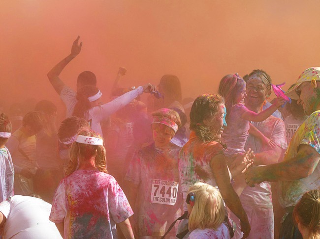 Runners are shown at a dust party after the first Color Run in downtown Las Vegas, Saturday, Feb. 25, 2012. About 5,000 participants ran a 5K event which benefits the Three Square charity.