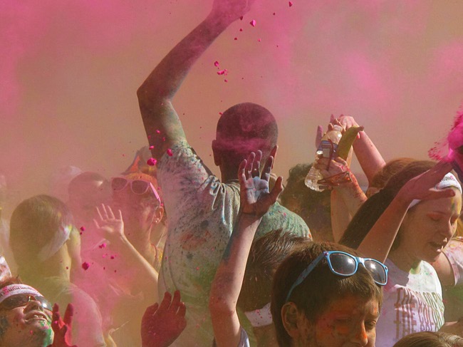 Runners are shown at s dust party after the first Color Run in downtown Las Vegas, Saturday, Feb. 25, 2012. About 5,000 participants ran a 5K event which benefits the Three Square charity.